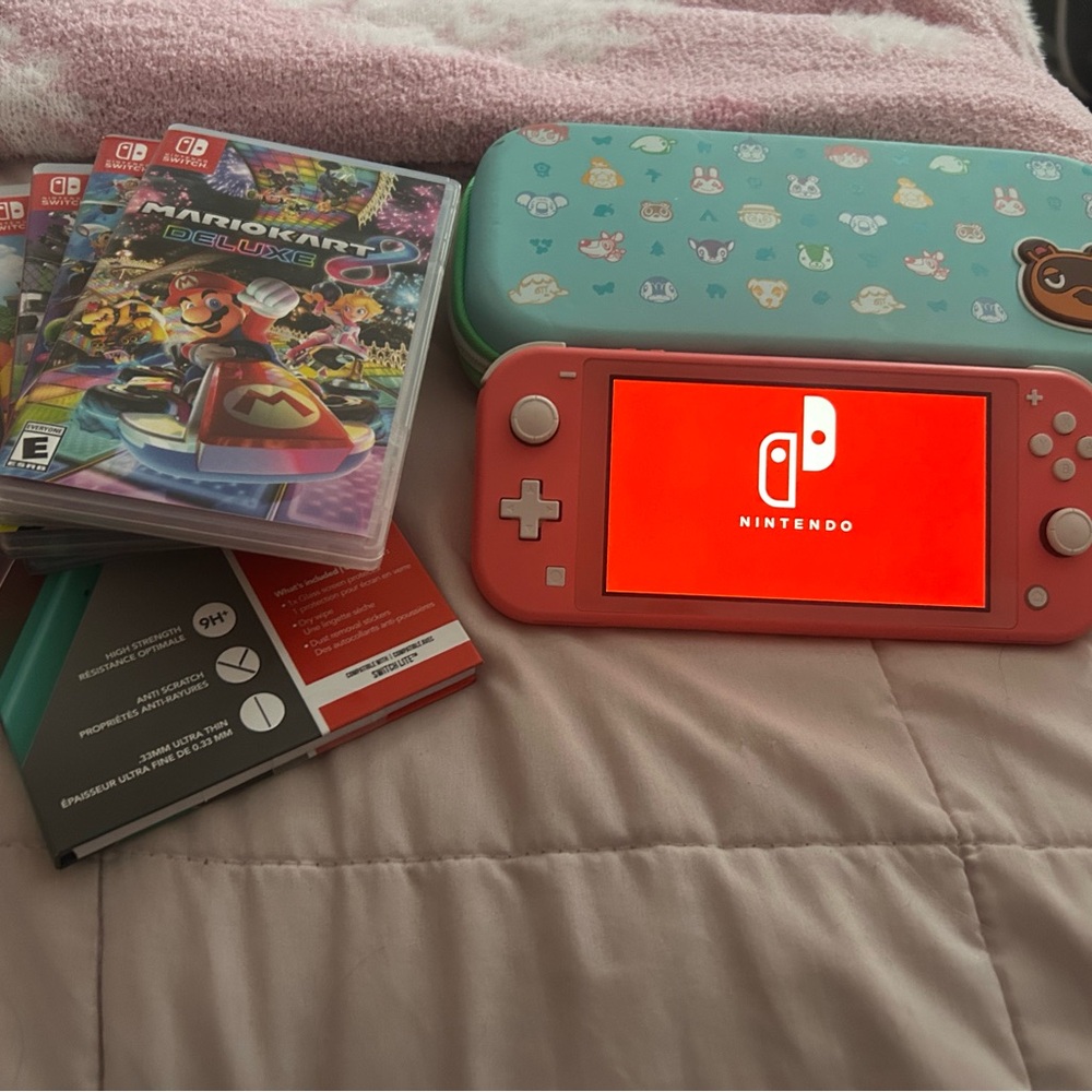 Nintendo Switch Lite Coral with Games and Case